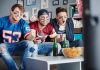 men-watching-football-eating-chips.jpg - ReactMedia